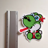ruler showing approximate height of green Yoshi ayeconic kitty sticker slap at 4 inches
